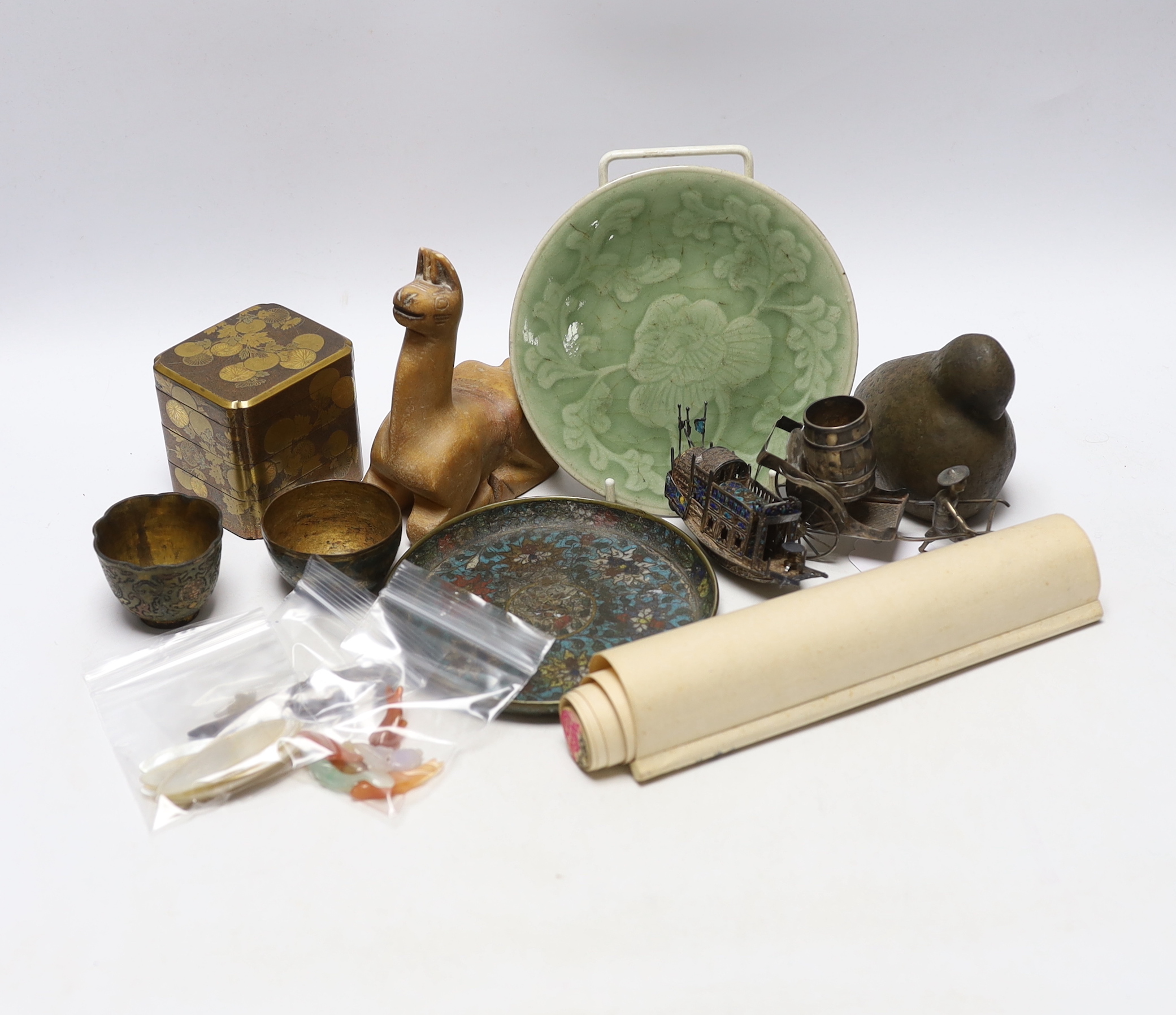 A Japanese lacquer three tier box and enamelled white metal miniature junk, gaming counters and sundries
